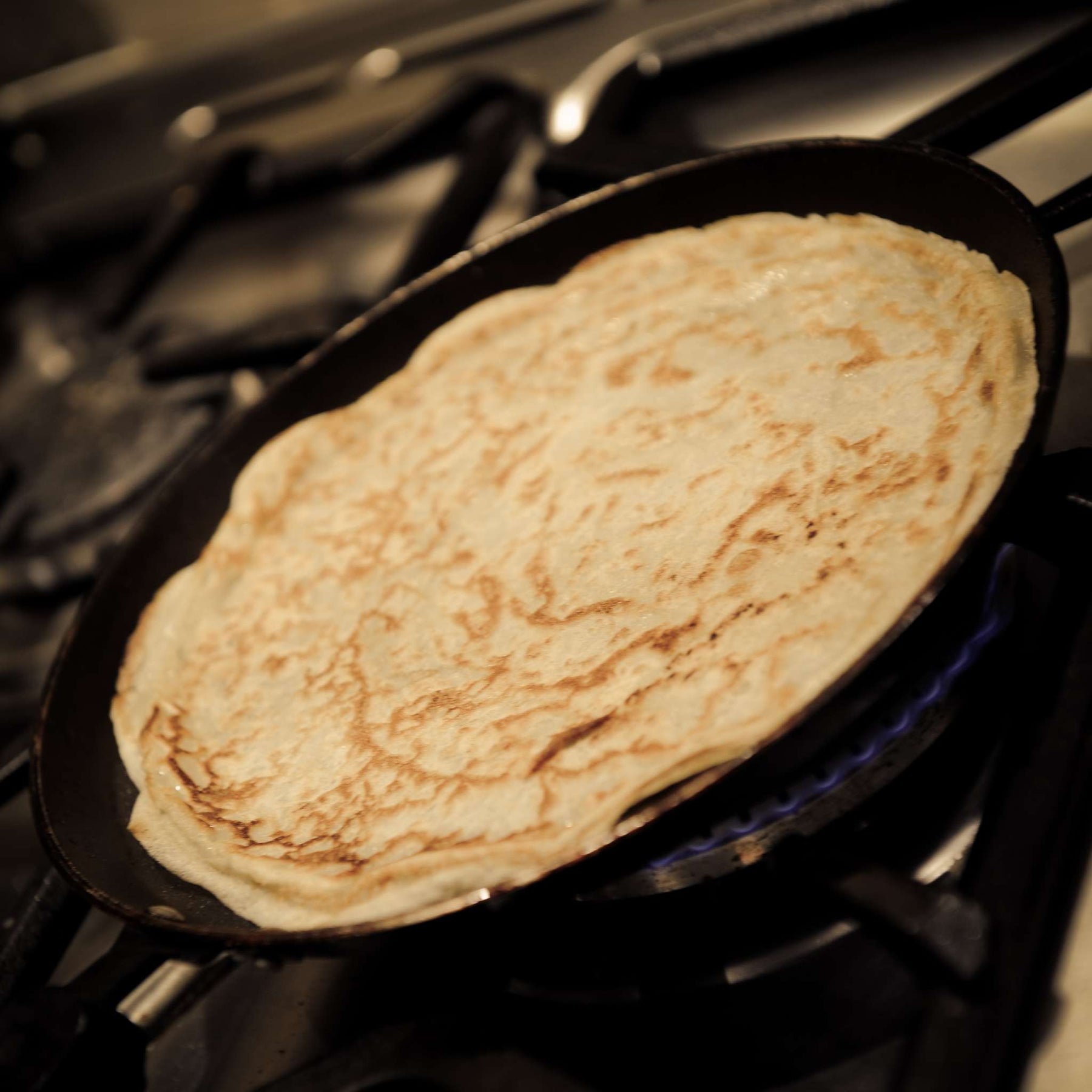Crepe made with all natural ingredients cooking in a frying pan